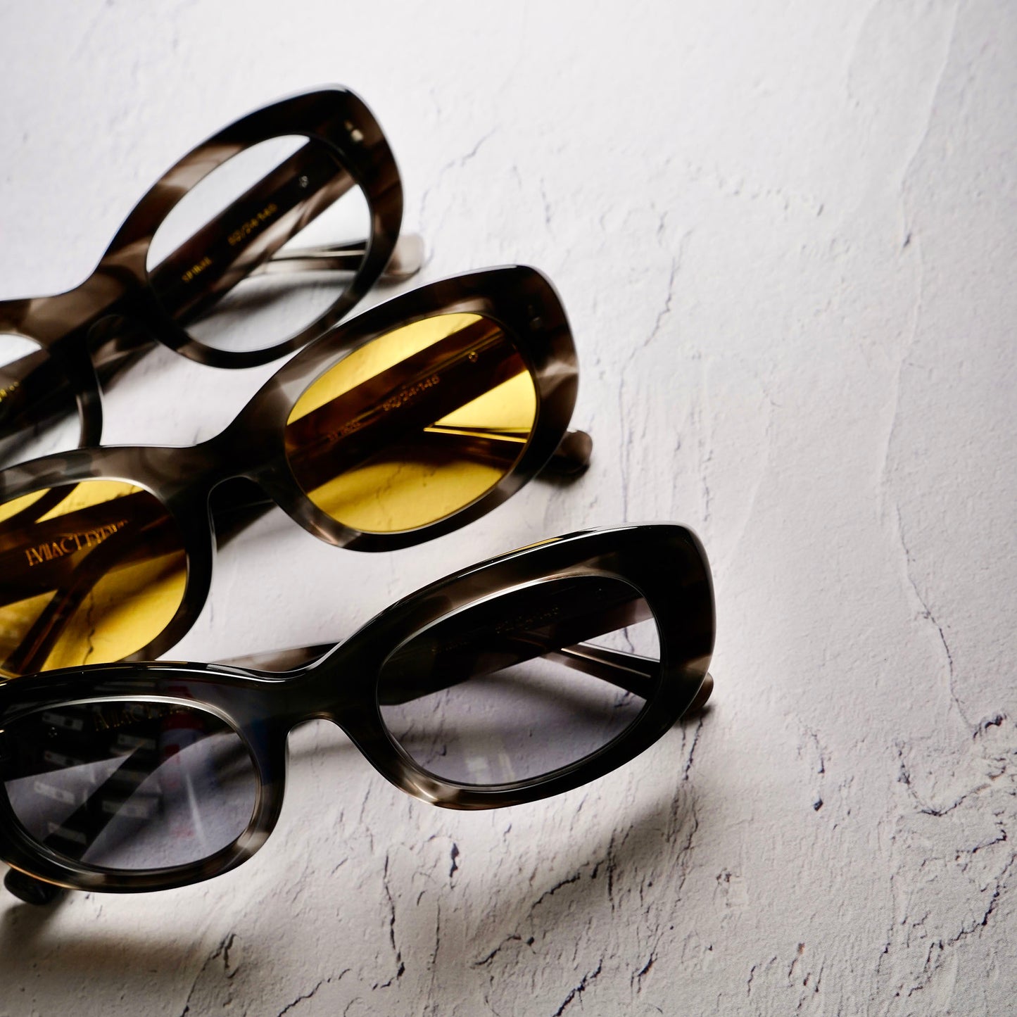SPIRAL black marble / yellow lens